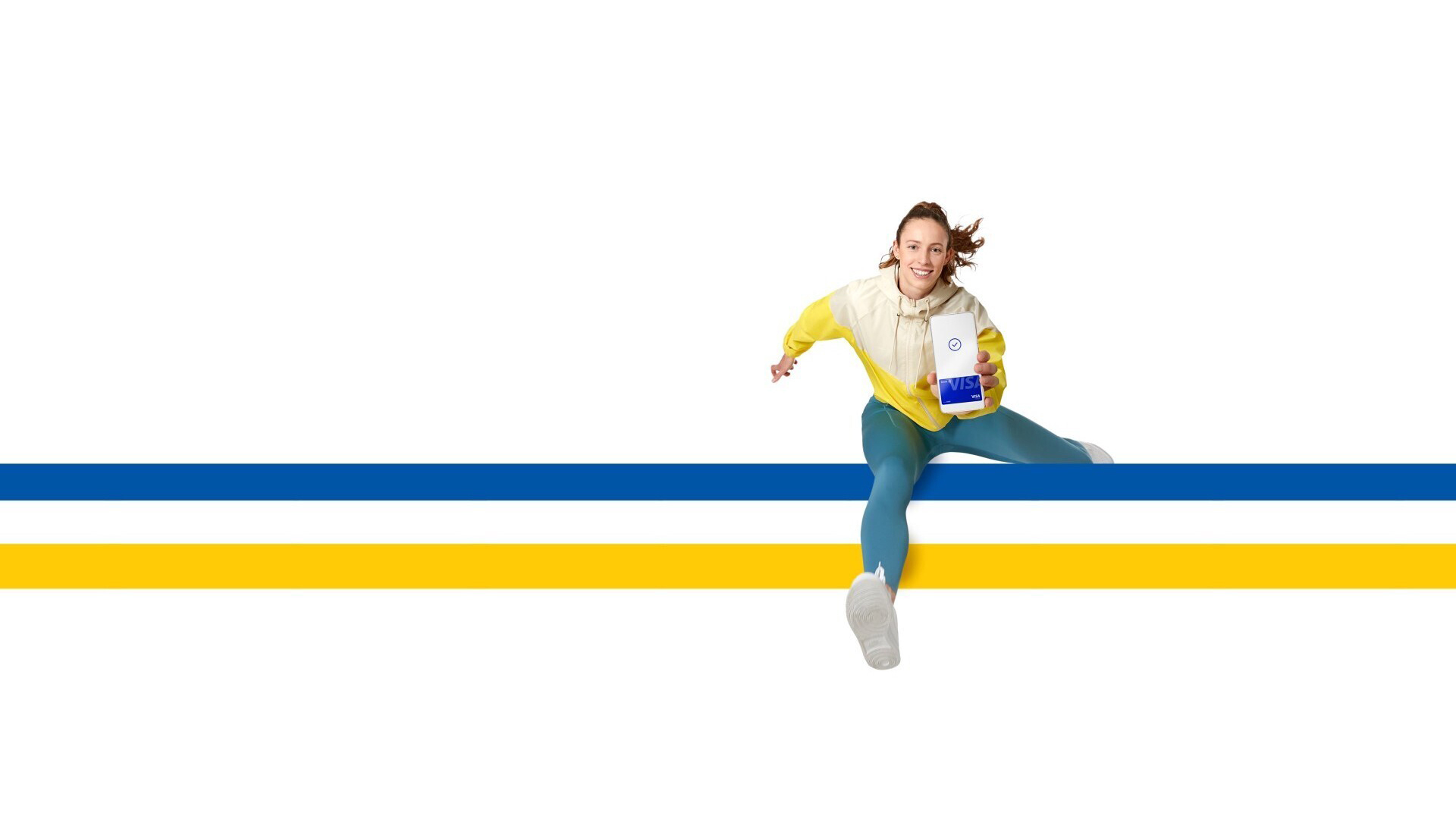 Woman jumping over hurdle