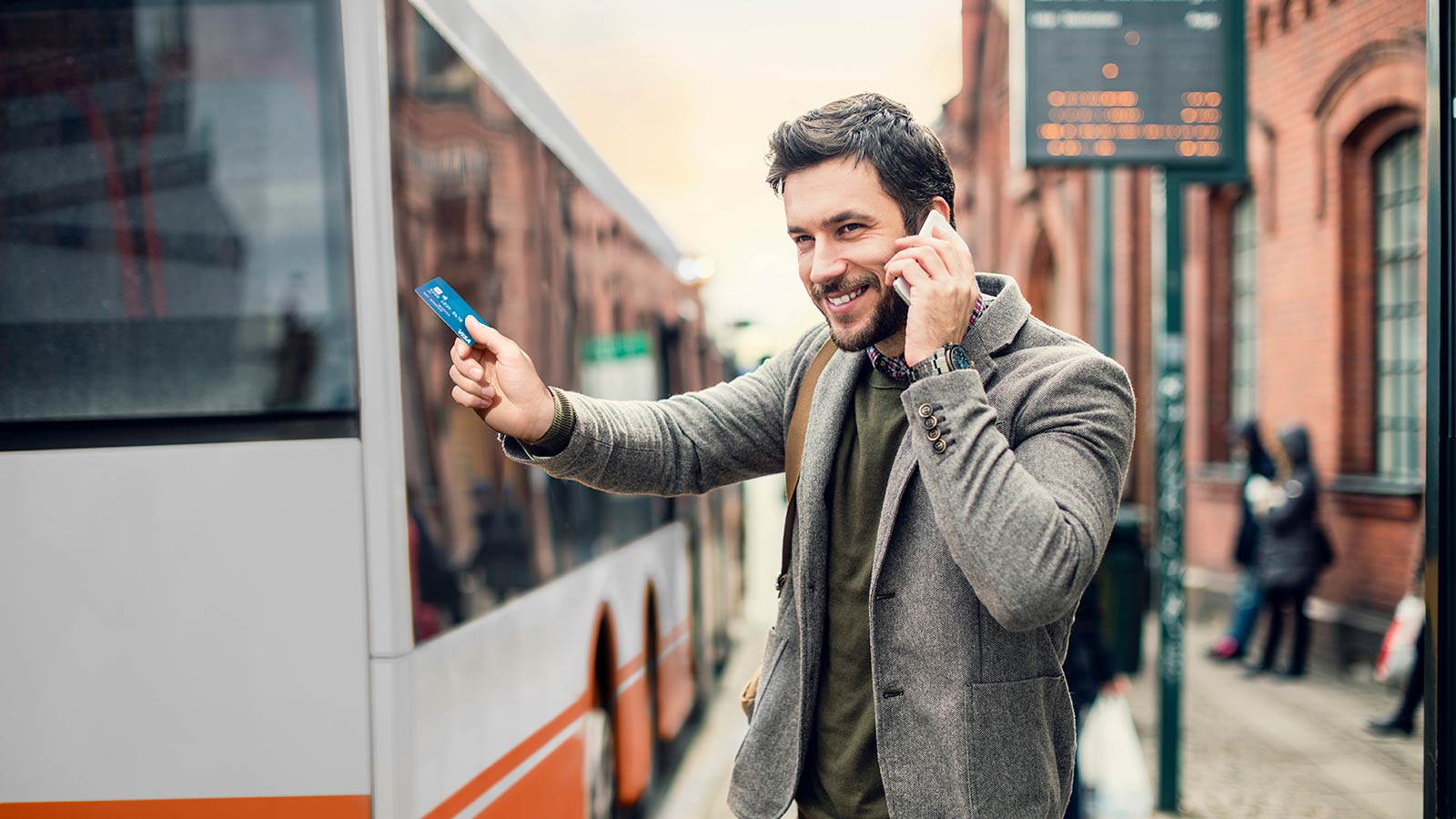 Man holding contactless card on the phone